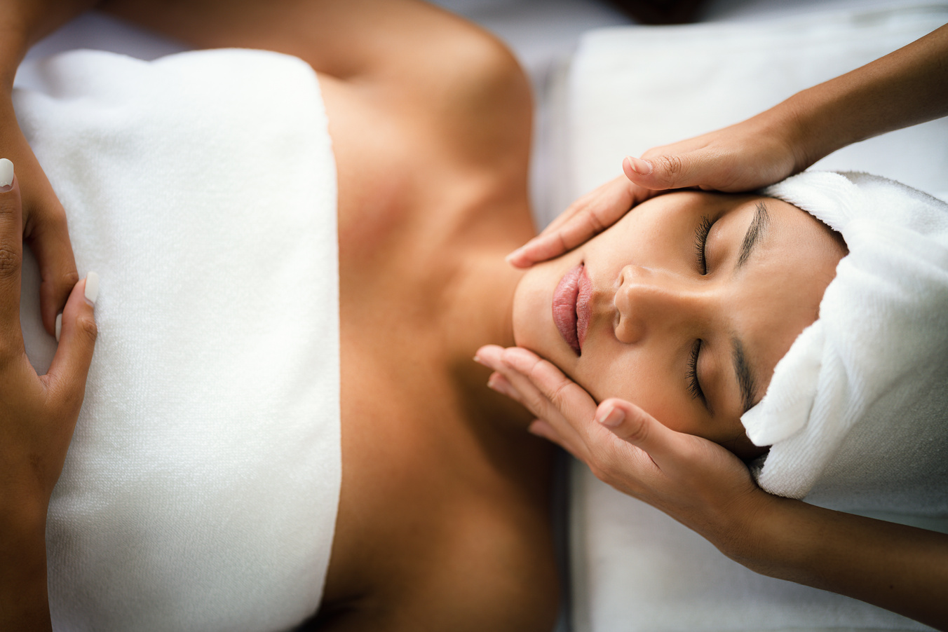 young asian woman getting spa facial spa massage treatment at beauty spa salon